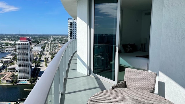 balcony featuring a water view