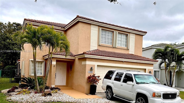 mediterranean / spanish-style house featuring a garage