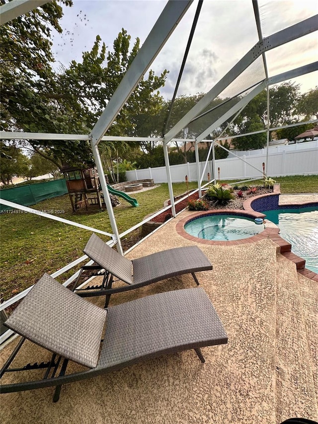 view of swimming pool with a lanai, a playground, an in ground hot tub, and a patio