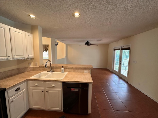 kitchen with sink, kitchen peninsula, white cabinets, and dishwasher