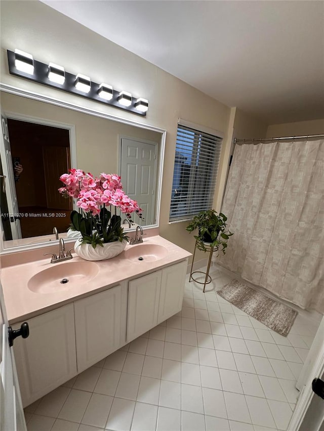 bathroom featuring tile patterned flooring and vanity