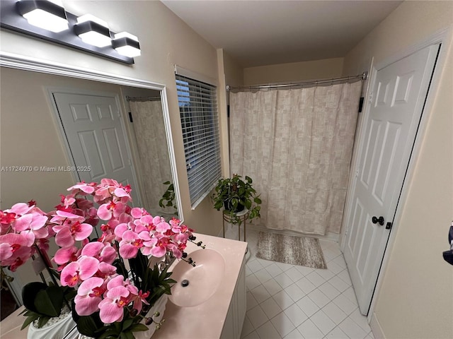 bathroom with vanity, a shower with curtain, and tile patterned floors