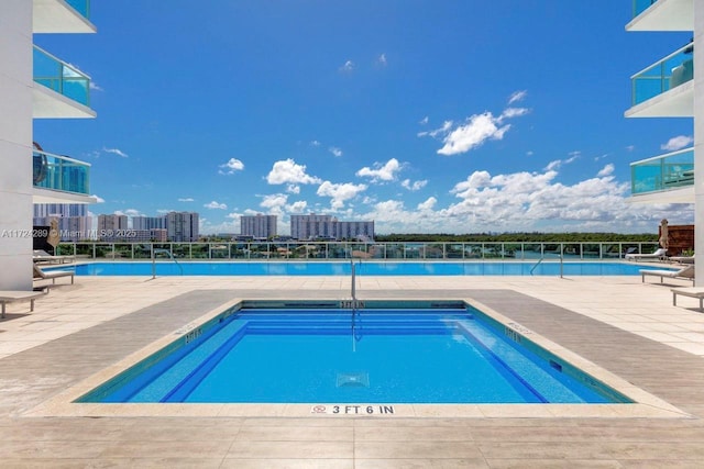 view of swimming pool featuring a patio