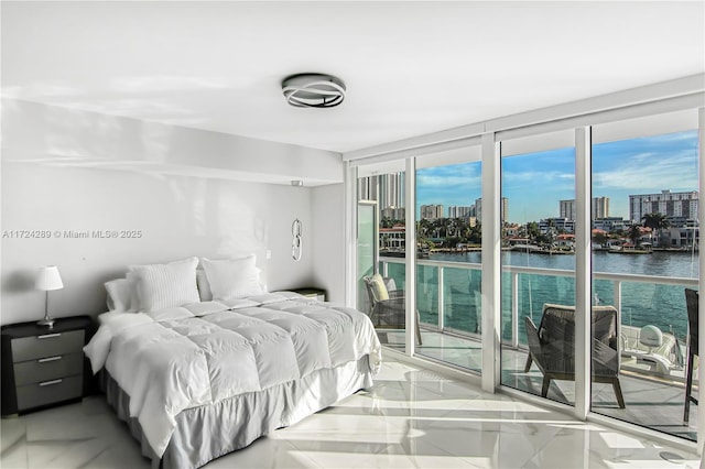 bedroom featuring a water view, expansive windows, light tile patterned floors, and access to outside