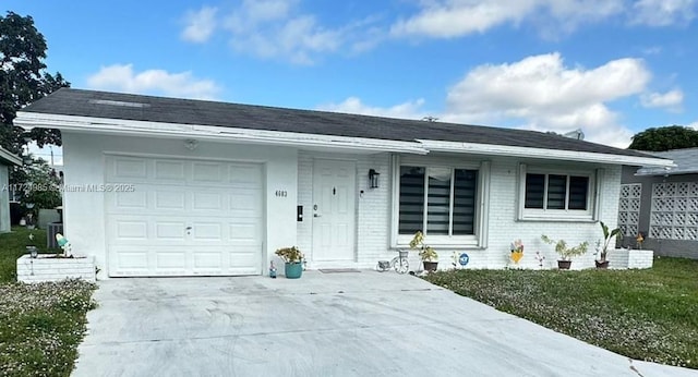 single story home with a garage