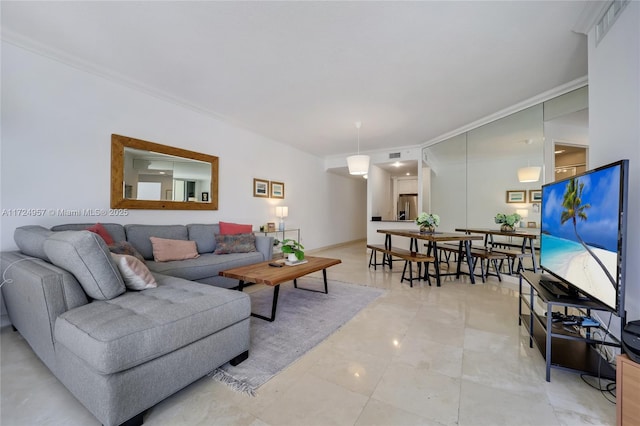 living room with ornamental molding