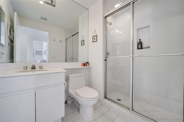 bathroom with a shower with shower door, tile patterned floors, vanity, and toilet