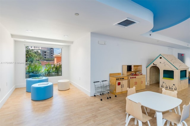 playroom featuring light hardwood / wood-style floors