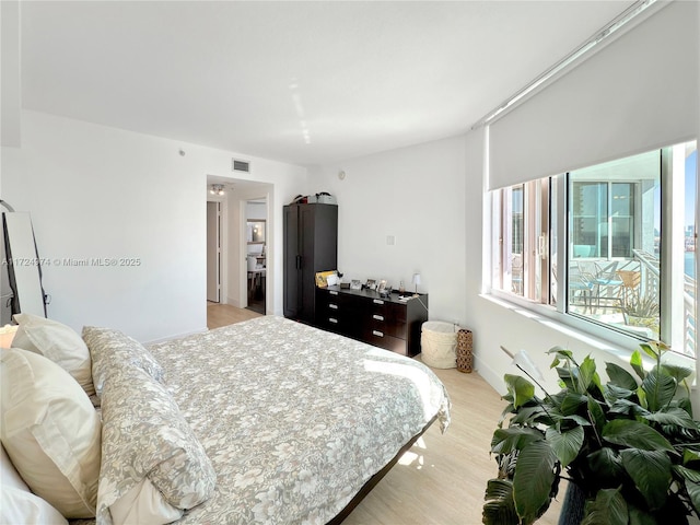 bedroom with light wood-type flooring