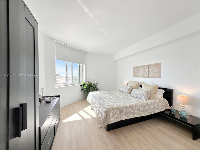 bedroom featuring light hardwood / wood-style floors