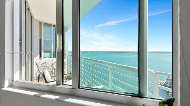 balcony featuring a water view