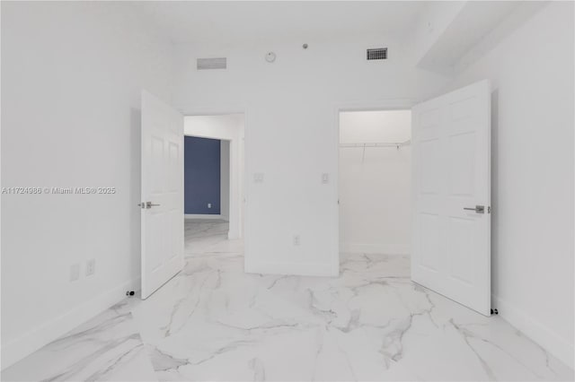 bedroom with marble finish floor, visible vents, and baseboards