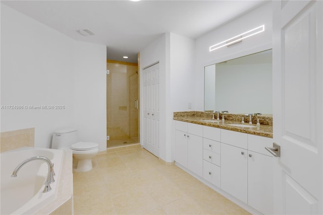 full bath featuring double vanity, a closet, toilet, a sink, and a bath