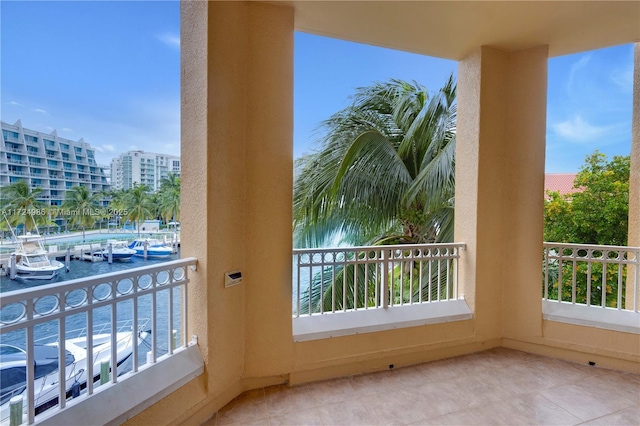 balcony featuring a water view