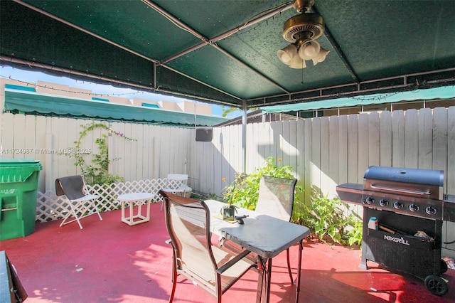 view of patio with ceiling fan and a grill