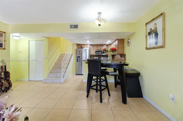 dining room featuring light tile patterned flooring