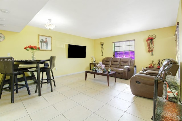 living room featuring an inviting chandelier and light tile patterned flooring