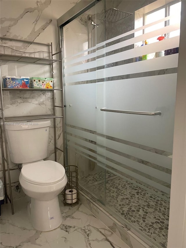 bathroom with walk in shower and toilet