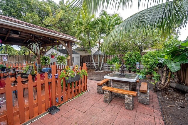 view of patio / terrace featuring a storage unit