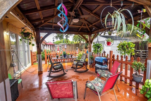 view of patio / terrace featuring ceiling fan and a gazebo