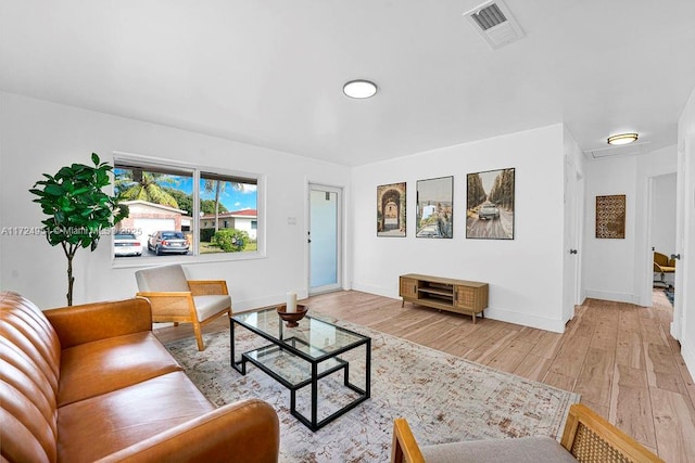 living room with light hardwood / wood-style floors