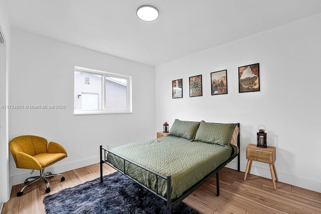 bedroom featuring wood-type flooring