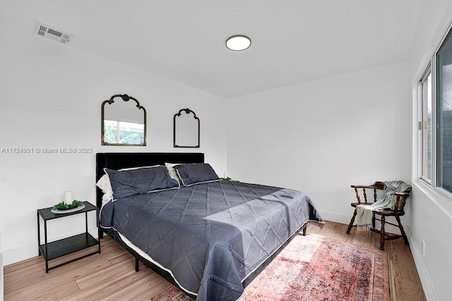 bedroom with light hardwood / wood-style flooring