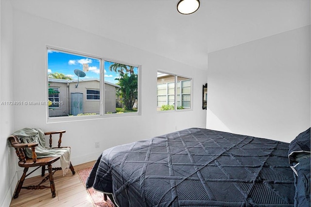 bedroom with hardwood / wood-style flooring