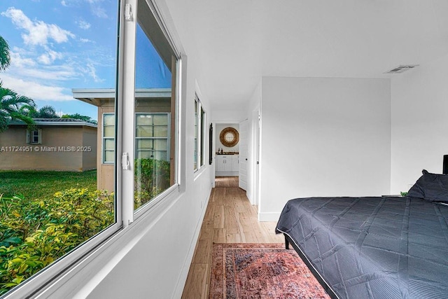 bedroom with light wood-type flooring