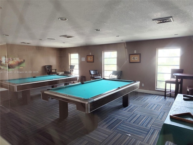 playroom featuring dark colored carpet, a textured ceiling, and billiards