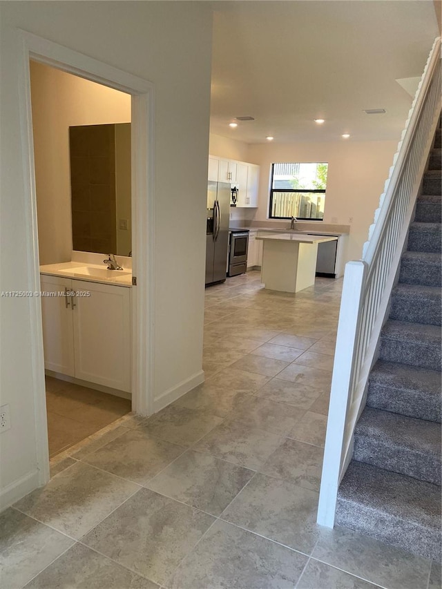 hallway featuring sink