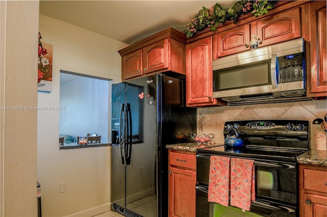 kitchen featuring tile patterned flooring, backsplash, black appliances, and dark stone countertops