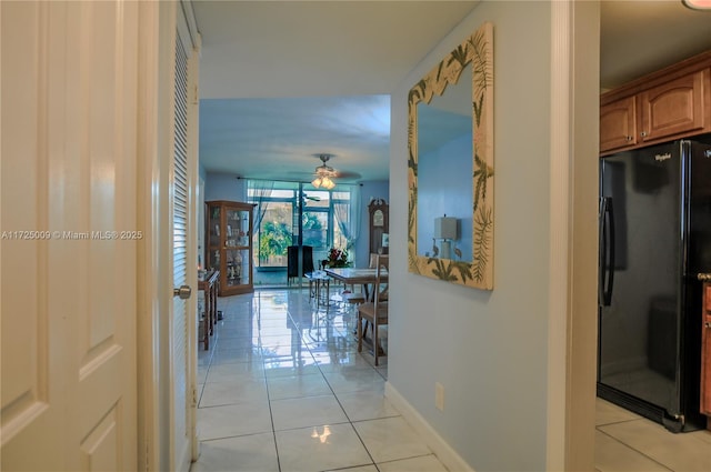 corridor with light tile patterned floors