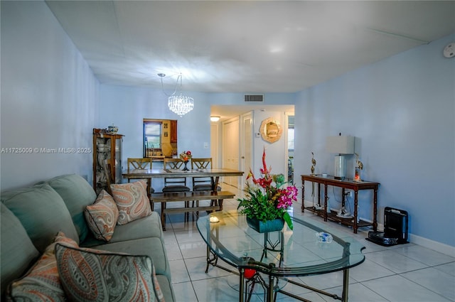 living room with an inviting chandelier and light tile patterned floors