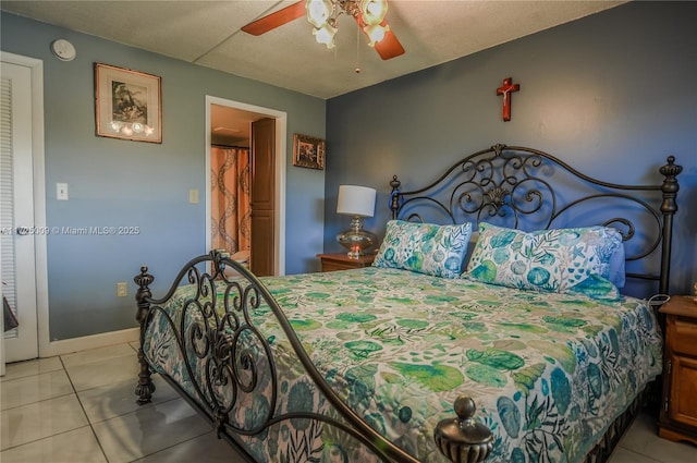 bedroom with ceiling fan and light tile patterned floors