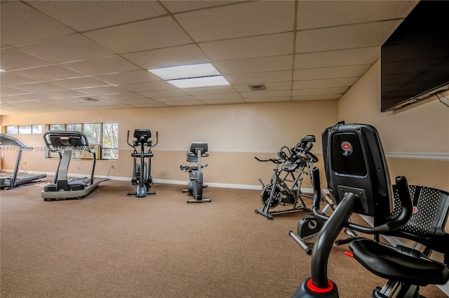 exercise room featuring a drop ceiling