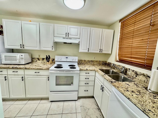 kitchen with white cabinetry, white appliances, and sink