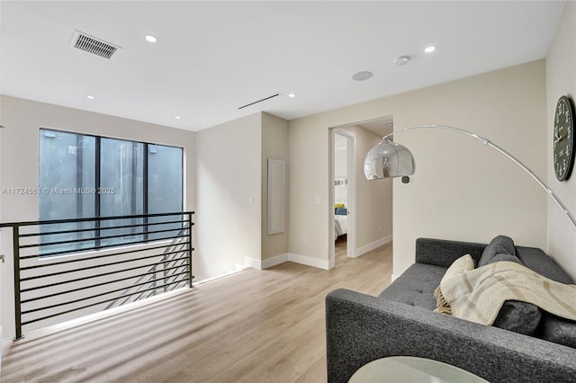 living room with light hardwood / wood-style flooring