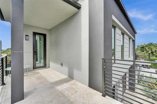 entrance to property featuring a balcony