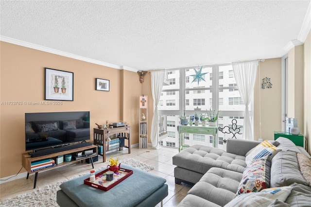 living room featuring light tile patterned floors, ornamental molding, a textured ceiling, and a wall of windows