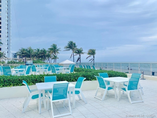 view of patio with a water view