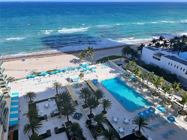 bird's eye view featuring a view of the beach and a water view