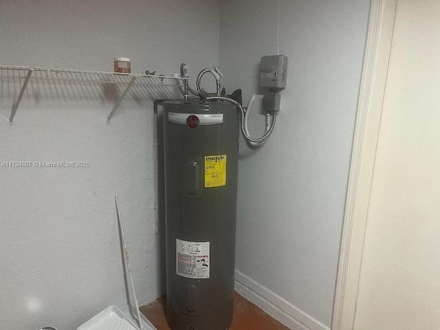 utility room featuring water heater