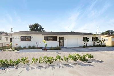 ranch-style house featuring a garage