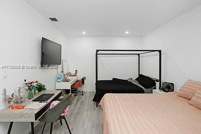 bedroom featuring light hardwood / wood-style floors