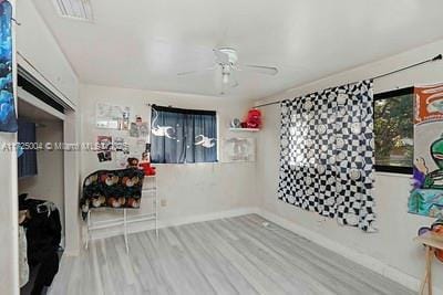 interior space featuring light hardwood / wood-style floors and ceiling fan