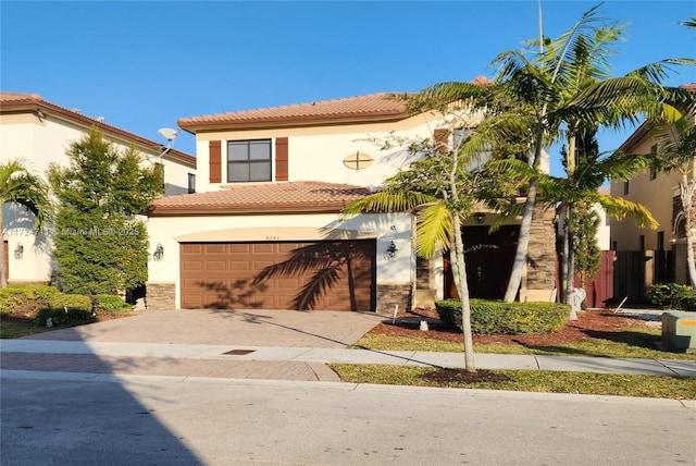 mediterranean / spanish house featuring a garage