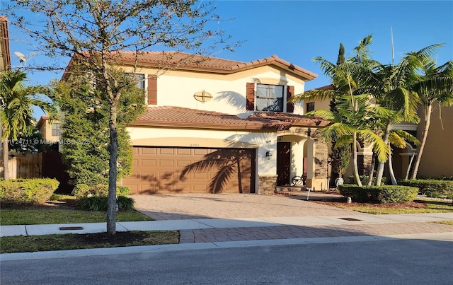 mediterranean / spanish-style home featuring a garage