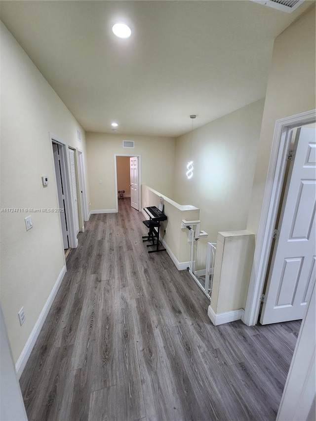 corridor featuring hardwood / wood-style floors