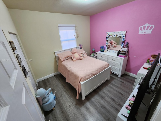 bedroom featuring dark wood-type flooring